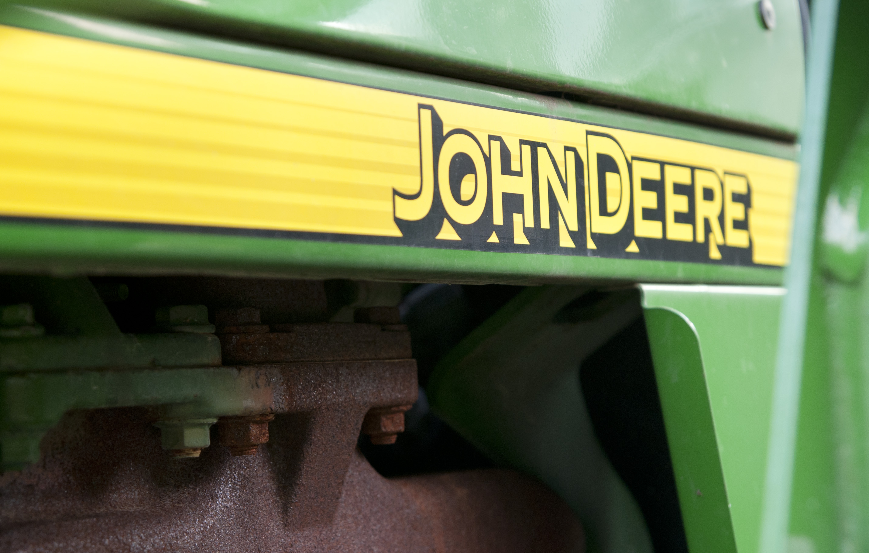 John Deere logo on green agricultural machinery
