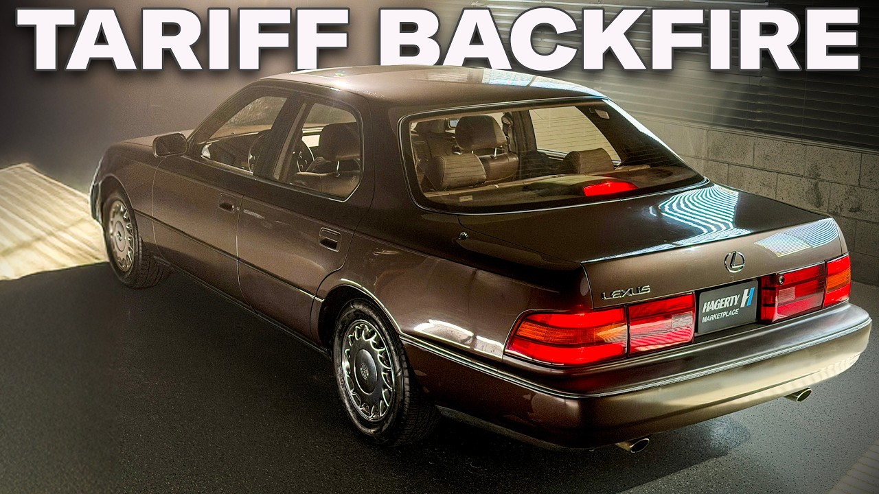 Brown Lexus LS sedan photographed in showroom with red taillights and chrome trim