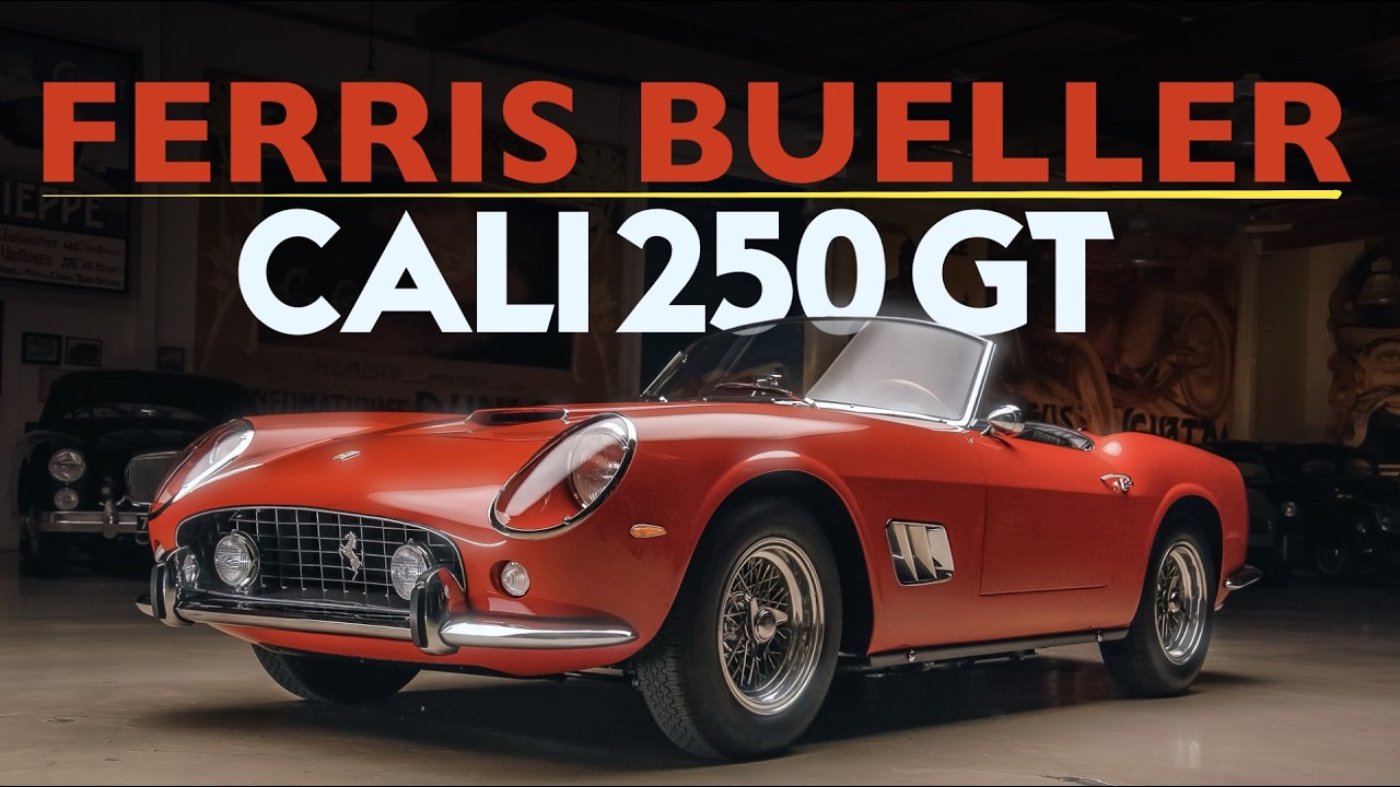 Red 1961 Ferrari 250 GT convertible sports car in showroom with classic design and white-wall tires