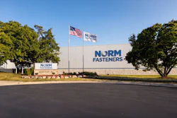 NORM Fasteners industrial facility exterior with company signage and American flag