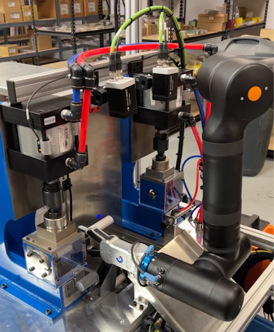 Industrial robotic arm with blue and red frame in warehouse laboratory setting