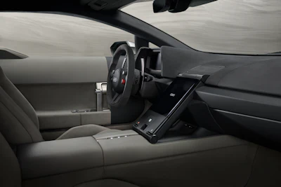 Modern car interior with steering wheel, dashboard, and center console viewed from driver's seat