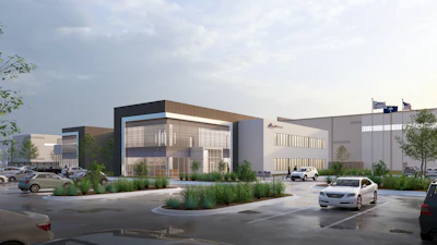 Modern industrial facility complex with contemporary architecture, parking area, and landscaping under cloudy sky