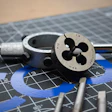 Metric thread die tool with M12 HSS marking on engineering blueprint