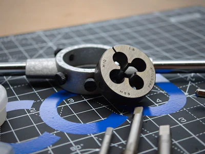 Metric thread die tool with M12 HSS marking on engineering blueprint