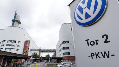 Volkswagen facility entrance with Tor 2 PKW signage on modern building
