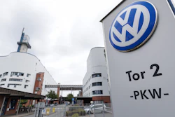 Volkswagen facility entrance with Tor 2 PKW signage on modern building