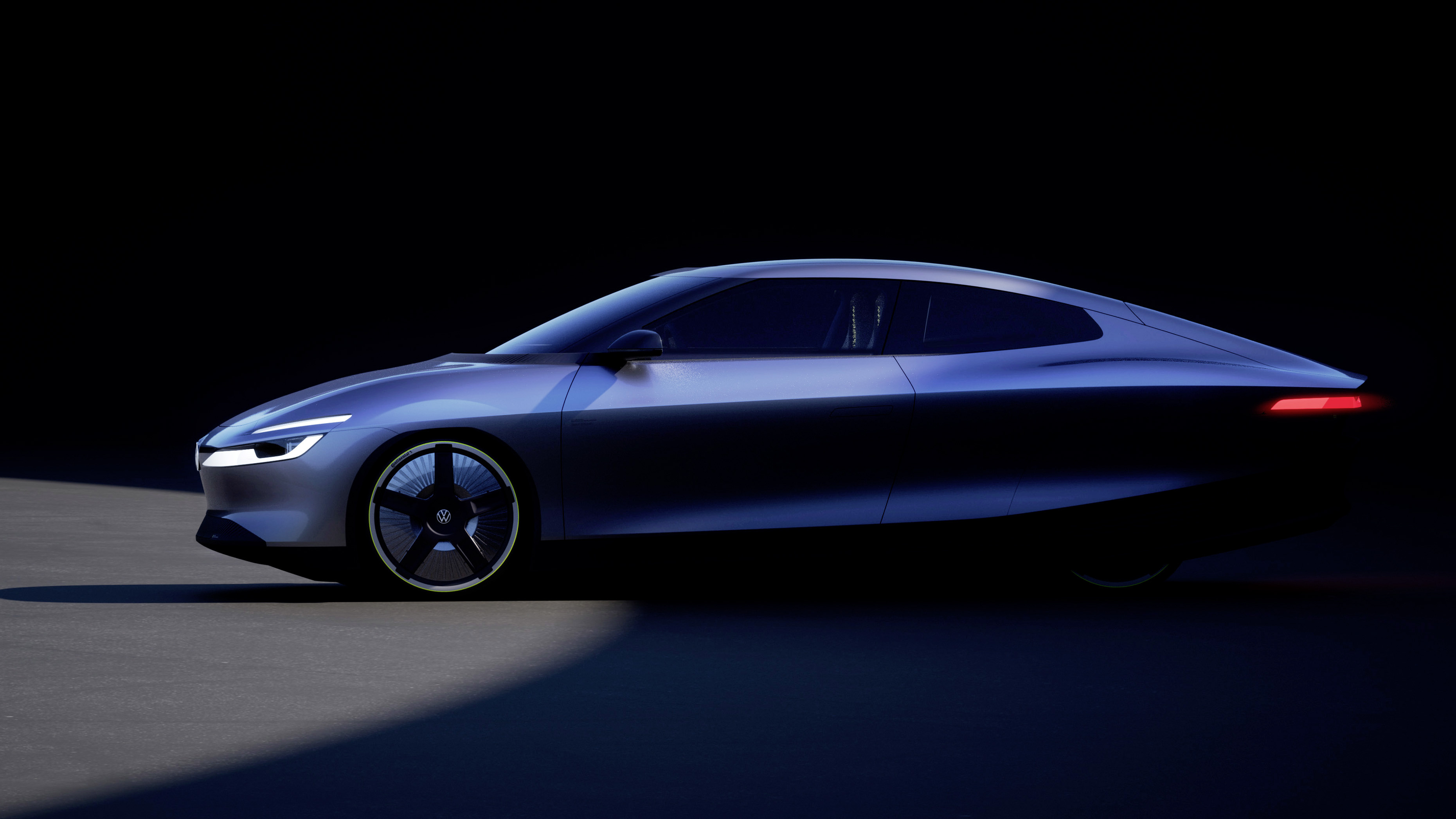 Blue metallic concept car with sleek aerodynamic design and futuristic styling on dark background