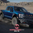 Blue Chevrolet pickup truck kicking up dust in desert landscape with mountains