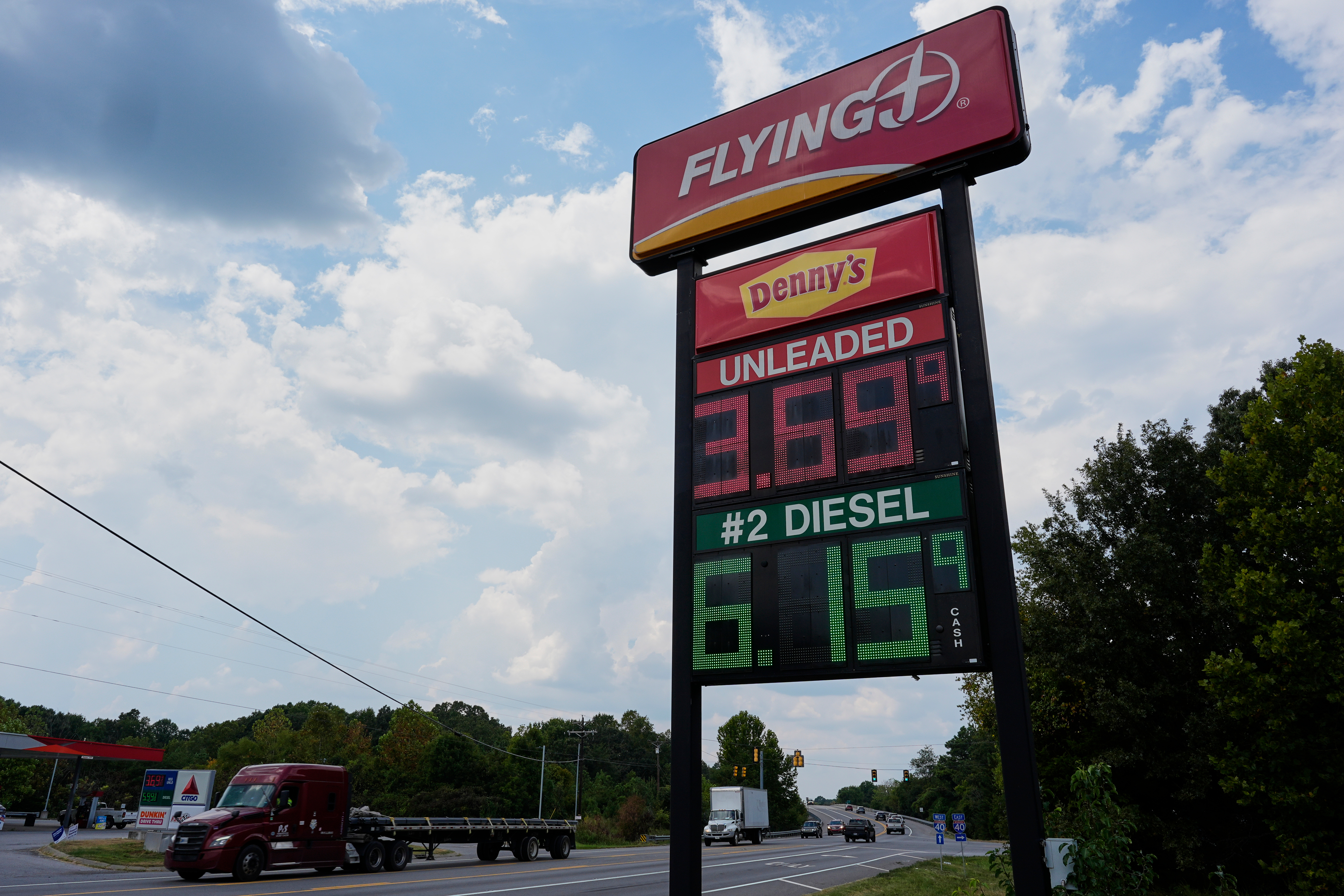 Flying J gas station price sign displaying unleaded fuel at $3.69 and diesel at $6.15 with Denny's branding