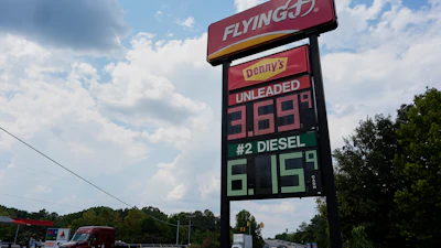 Flying J gas station price sign displaying unleaded fuel at $3.69 and diesel at $6.15 with Denny's branding