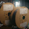 Two Fabshield fiber optic cable spools with product labels in industrial storage setting