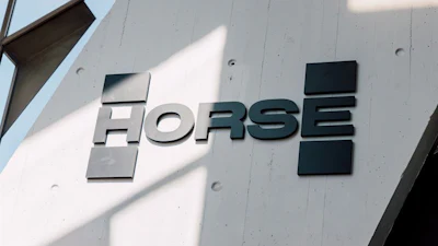 HORSE brand dimensional metal signage mounted on white concrete building exterior with geometric design elements
