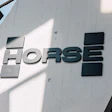 HORSE brand dimensional metal signage mounted on white concrete building exterior with geometric design elements