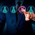 Businessman selecting highlighted employee from group of candidates in digital recruitment interface