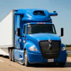 Blue Peterbilt semi-truck with white refrigerated cargo trailer driving on highway