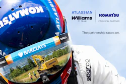 Racing helmet with Atlassian and Williams F1 Team branding, featuring Komatsu partnership announcement and multiple sponsor logos