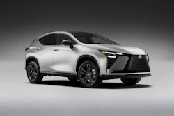 White Lexus UX compact crossover SUV displayed against neutral gray background