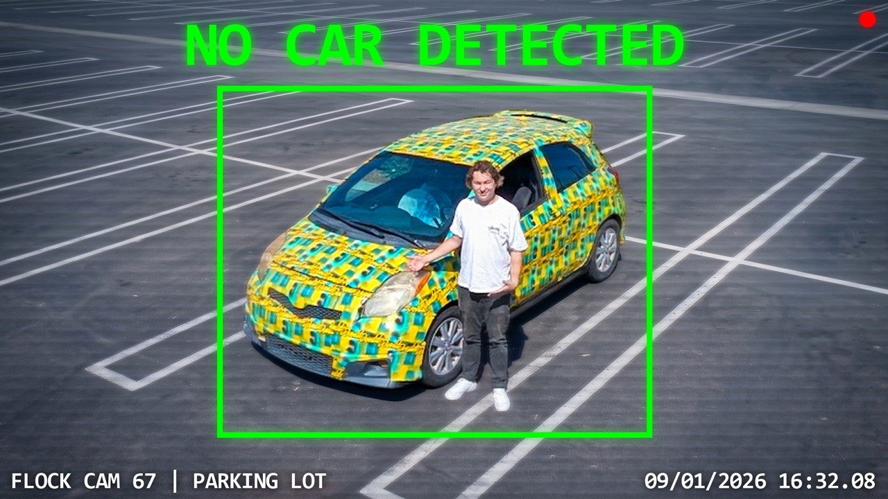 Person standing next to yellow and blue checkered wrapped vehicle in parking lot captured by security camera