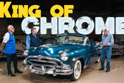 Three men stand beside a restored turquoise 1950s convertible car in a showroom with 'King of Chrome' text overlay