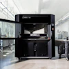 Stratasys F170 3D printer in industrial laboratory setting with white walls and equipment