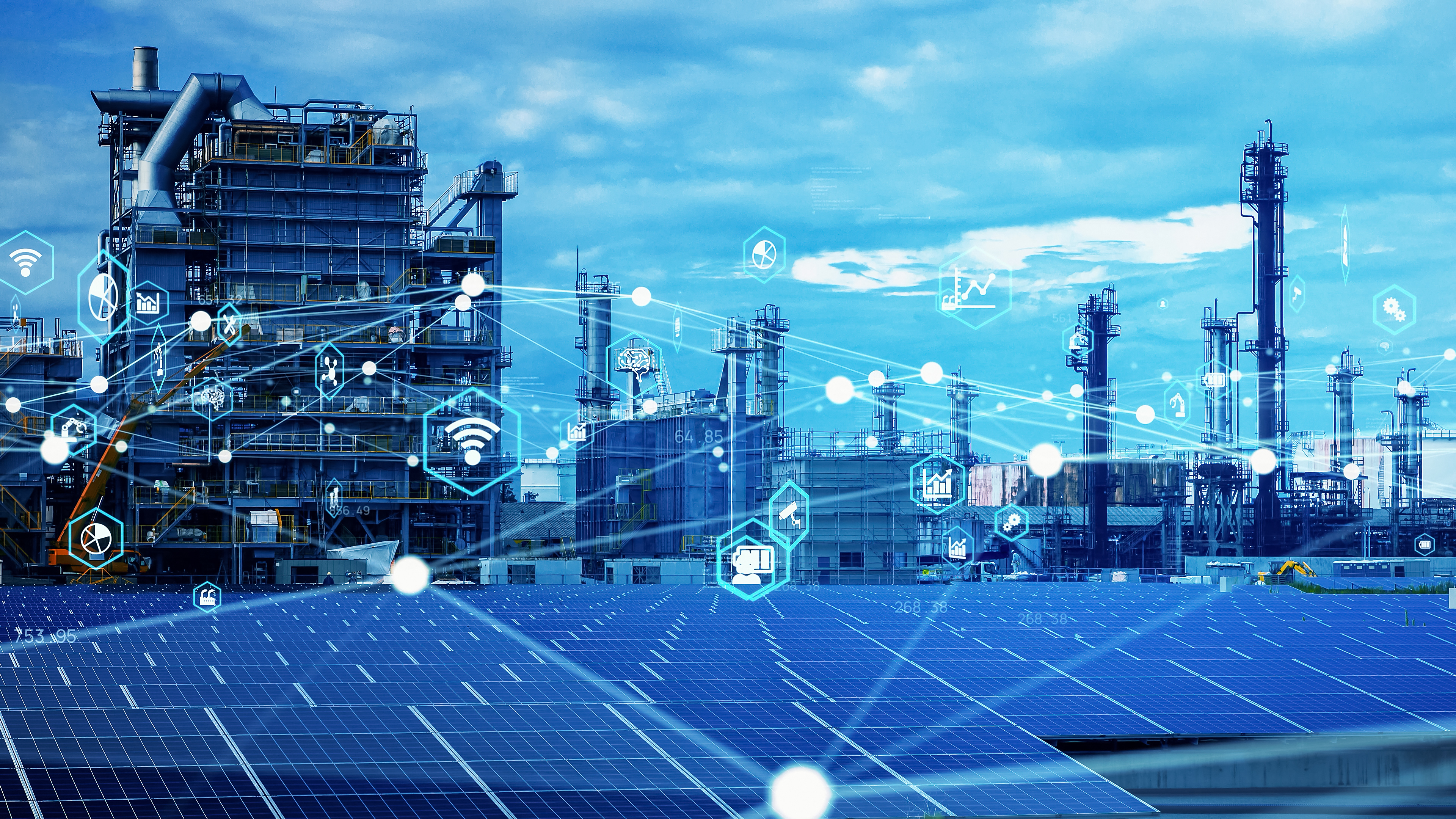 Industrial refinery facility with solar panels and digital technology icons representing smart manufacturing and renewable energy integration
