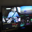 Multi-camera dashcam display showing driver, road view, and vehicle telemetry data with speed and performance metrics