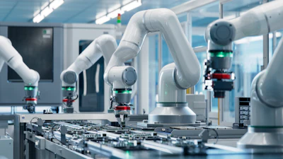 White collaborative robotic arms assembling electronic circuit boards in a modern manufacturing facility