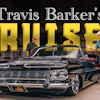Travis Barker's classic black convertible cruiser displayed in showroom with two men standing beside the vintage 1950s car