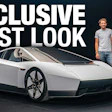 Exclusive first look at futuristic white concept car with two men standing beside it against dark background