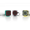Three colorful retro-style measuring tapes in teal, gray, and yellow-green with white measurement scales displayed against a white background